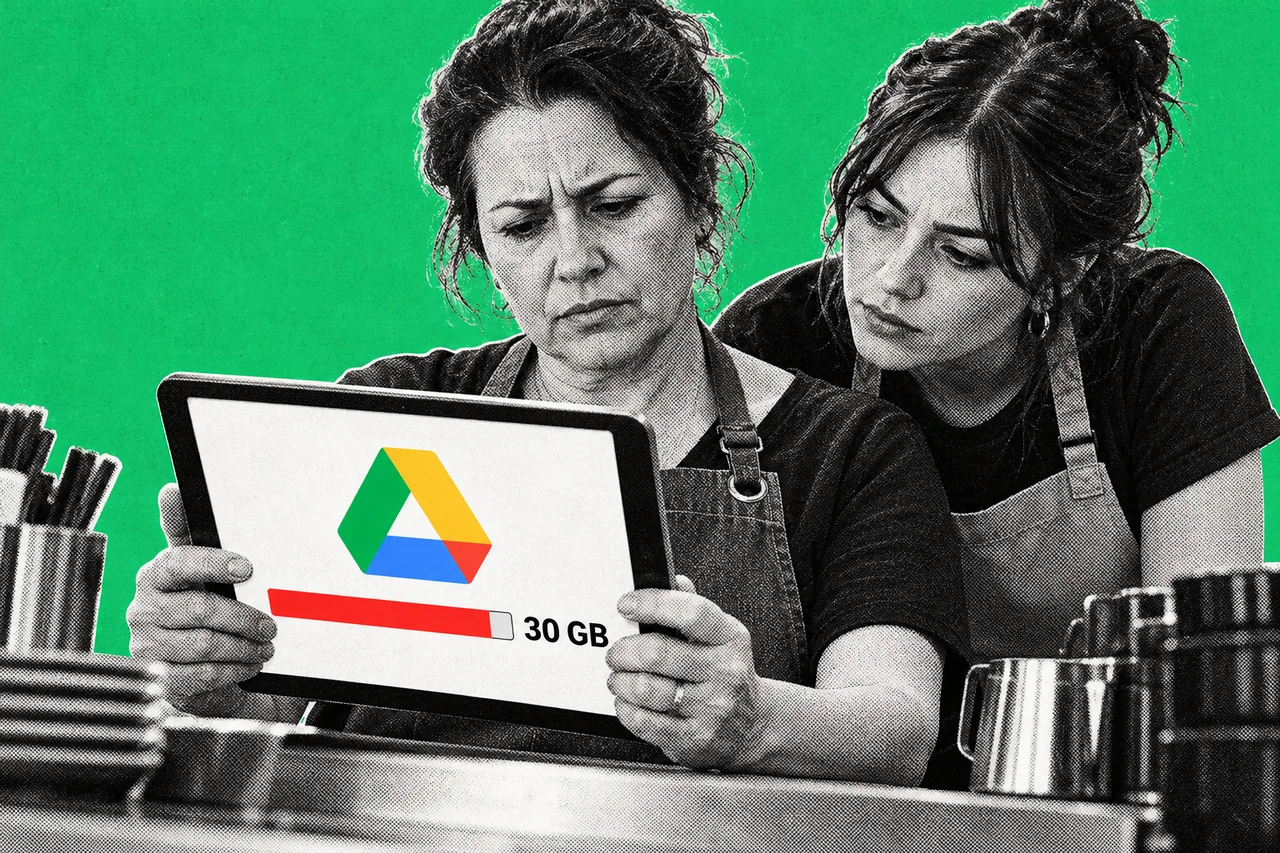 a halftone café owner in an apron standing behind her counter, frowning at a halftone tablet held in both hands, while a younger halftone staff member leans over her shoulder to look. a full-colour storage bar on the tablet screen, filled almost to the end in red, with "30 GB" beside it and the multicoloured Google Drive triangle logo above it
